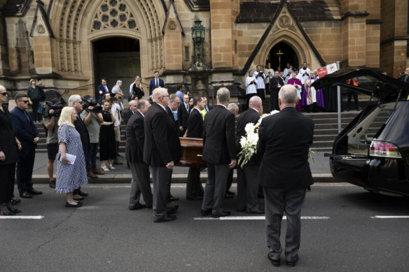 Cardinal George Pell’s coffin is carried into the cathedral.