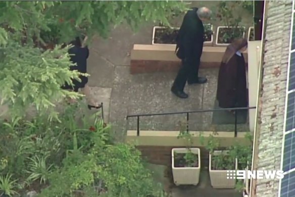 Cardinal Pell entering the Carmelite Monastery in Kew after he was released from Barwon Prison. 