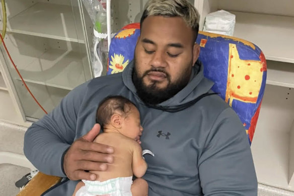Tupou and his newborn son Nela.