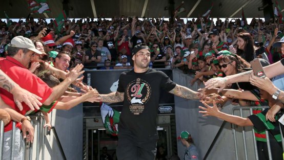 Glory, glory to South Sydney: Adam Reynolds and Rabbitohs fans celebrate their 2014 grand final triumph.
