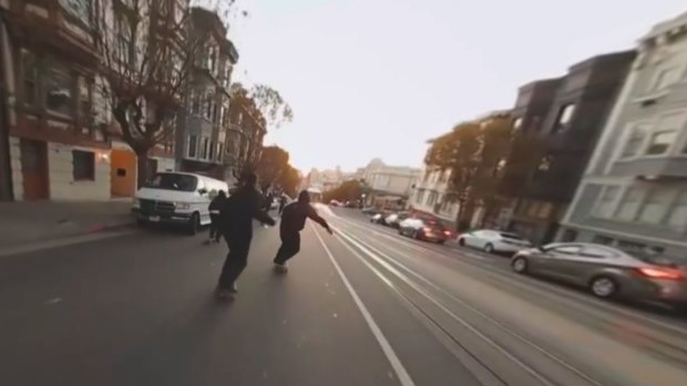 Skateboarders "bomb" down one of San Francisco's notoriously steep hills.