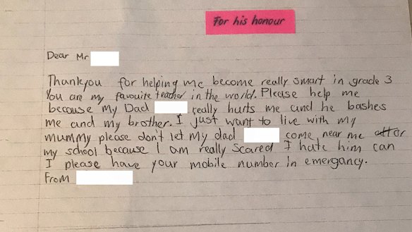 One of the children pens a letter to his teacher.