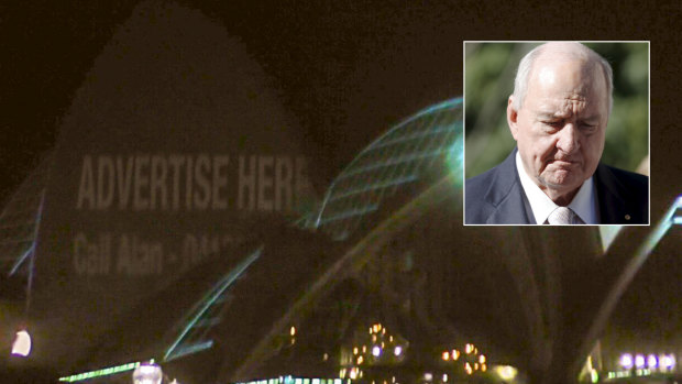 The Chaser projected an 'advertise here' sign on the Opera House on Monday night, with Alan Jones' mobile number.