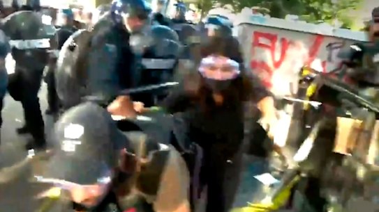 Australian journalist Amelia Brace and her cameraman Tim Myers have been struck by riot police during demonstrations in Washington DC.