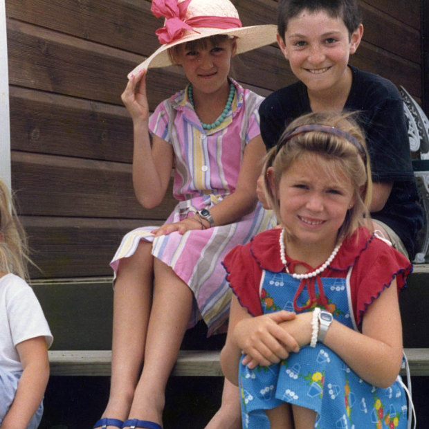 Jacinda (at front, in red and blue) with her sister Louise (in hat) and cousins Demelza and Aaron in 1987.