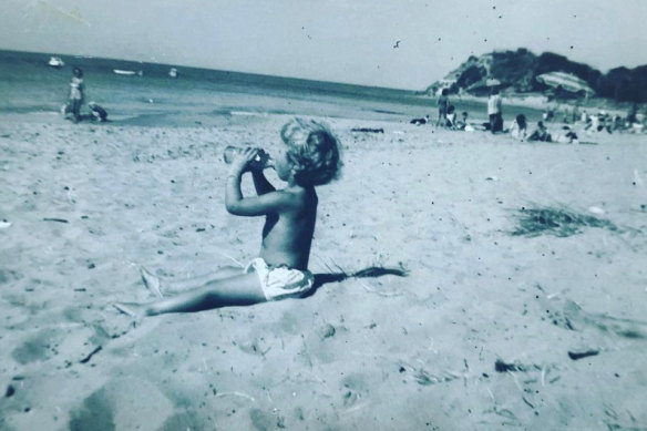 Corrie Perkin plays on the beach at Sorrento at the age of two.