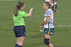 Georgina Friedrichs shows her wrist to the referee.