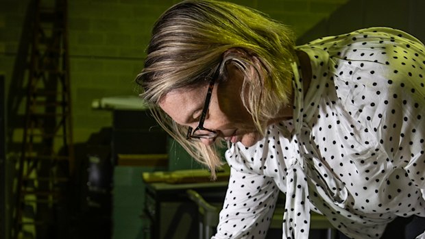 Sydney Morning Herald editor Jordan Baker looking at old editions in the Fairfax archives.