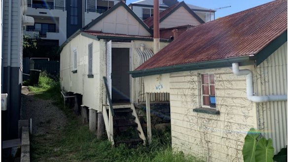 The rear of the property, showing the outbuilding.