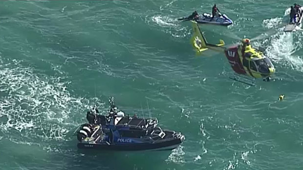 Helicopters, boats and jet skis scour the water off Stradbroke Island after several pieces of debris were found.