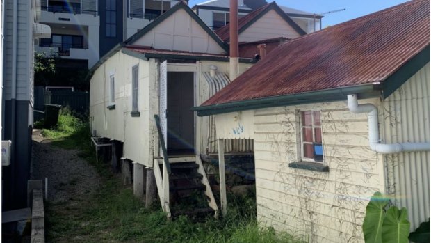 The rear of the property, showing the outbuilding.