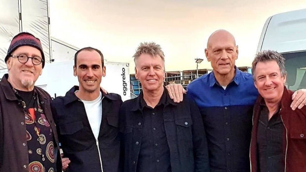 Refugee Mostafa ‘Moz’ Azimitabar, second from left, with Midnight Oil members Jim Moginie, Martin Rotsey, Peter Garrett and Rob Hirst. 