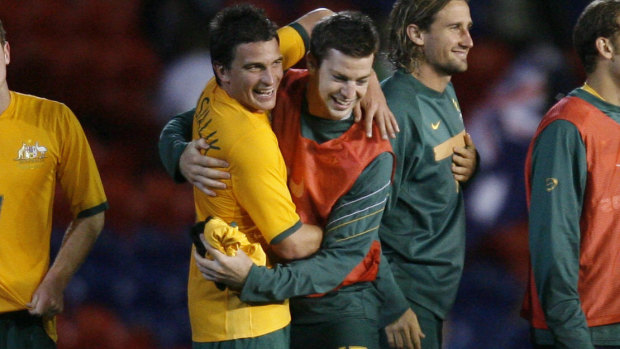 Mudgee's favourite son: Aaron Downes (right) celebrates with Stuart Musialik after a win by the Olyroos over North Korea in 2007.
