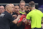 Egypt’s Mo Salah and the team’s coaching staff fume over a yellow card.