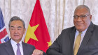 Fiji President Ratu Wiliame Katonivere greets the Chinese Foreign Minister Wang Yi at the State House in Suva on Monday.