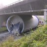 The section of wind turbine jammed under the Mount Crosby Road overpass on the Warrego Highway on May 17, 2025.