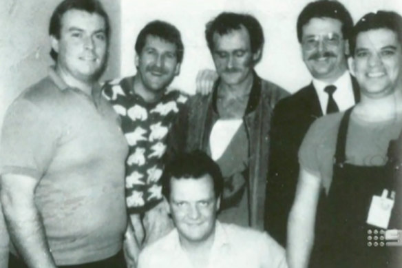 The ultimate trophy photo: armed robbery detectives, including Ken Ashworth on the left, with a captive Russell Cox. 