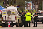 A police officer has been stabbed in the neck in Adelaide.