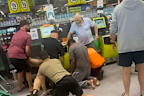 Shopper tackles man allegedly assaulting customers at Woolies.