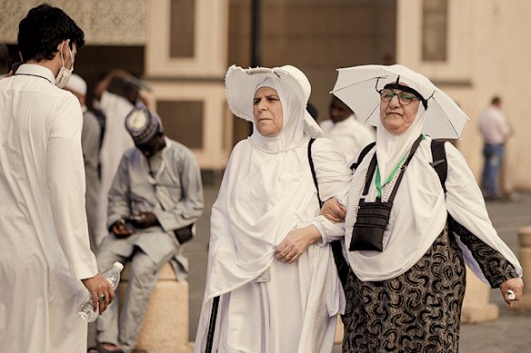 Two pilgrims ready for the heat of the Haj in Mecca in May.