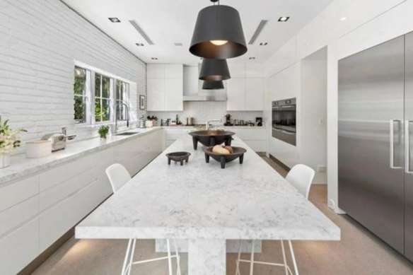 The professional kitchen features marble benchtops.