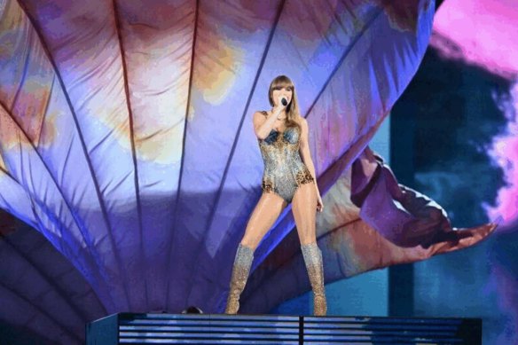 ‘An Aussie crowd will never let anything get in the way’: Swift lauds Sydney for defying storm