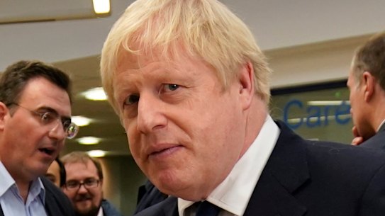 British Prime Minister Boris Johnson speaks to staff and students at Bolton University in England on Saturday.