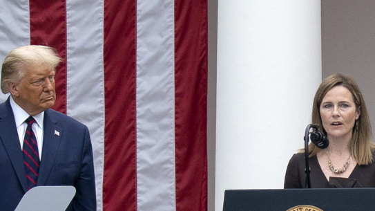 Closely clustered people at the Rose Garden event on Saturday for Amy Coney Barrett, US President Donald Trump's nominee for associate justice of the Supreme Court.