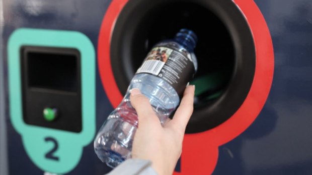 A reverse vending machine where clean containers are sorted and vouchers are issued.
