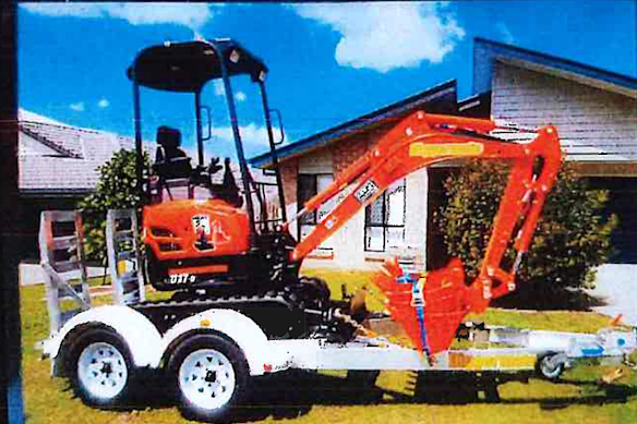 An excavator used to dig a trench at Waden’s house.