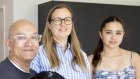 Colin Prasad with his wife Rita Horvath and daughter Sofia Prasad in their home on Phillip Island.