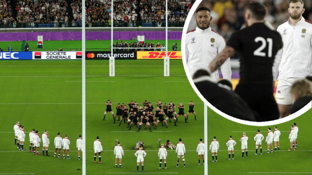New Zealand players perform a haka, facing England's "V" in Saturday's World Cup semi-final against England. 