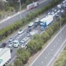 Truck rollover on Pacific Motorway
