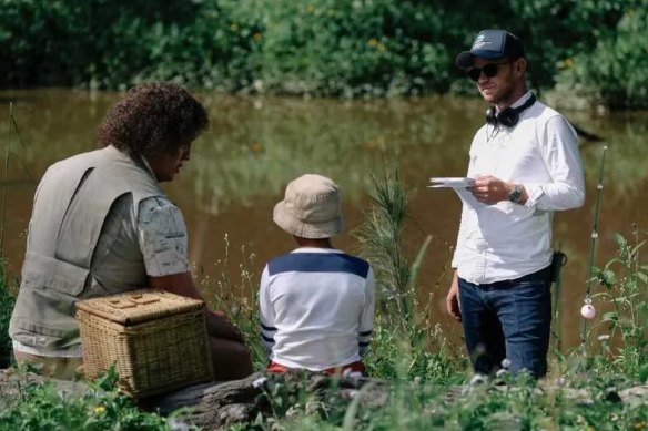 Jeffrey Walker (right) directing on the set of Young Rock.