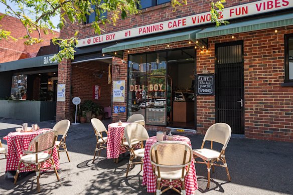 Outside the shop, where sunny streetside seating is available.