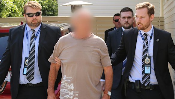 Queensland Police arrest Chris Dawson at a home on the Gold Coast on Wednesday morning. 