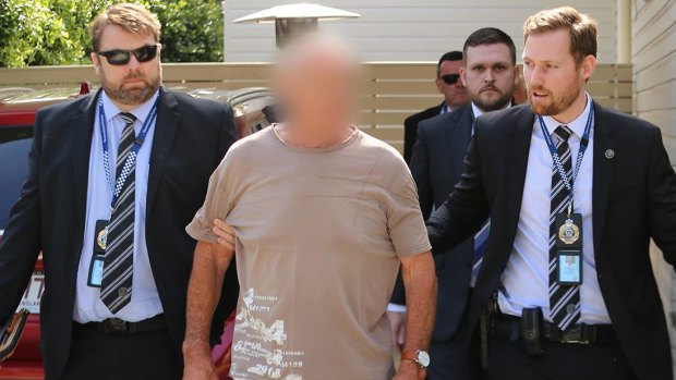 Queensland Police arrest Chris Dawson at a home on the Gold Coast on Wednesday morning. 