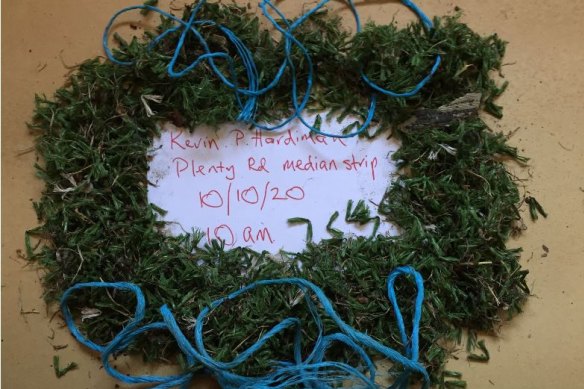 Tufts of plastic grass blown onto the median strip on Plenty Road at KP Hardiman Reserve on October 10 last year.