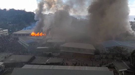 Buildings burn in Honiara’s Chinatown, in the Solomon Islands on Thursday. 
