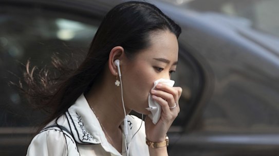 People wear masks in Sydney City due to the smoke haze from the bushfires. 21st November 2019 Picture Renee Nowytarger / SMH