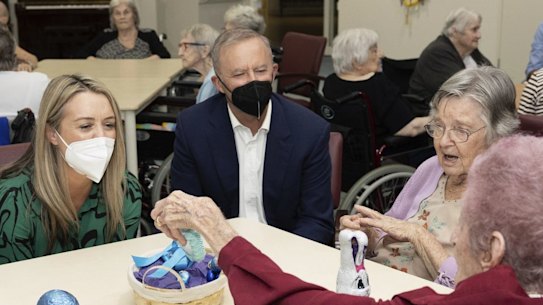 Prime Minister Anthony Albanese meets residents at an aged care facility during the election campaign. His government has now backed a “significant” pay rise for aged care workers.