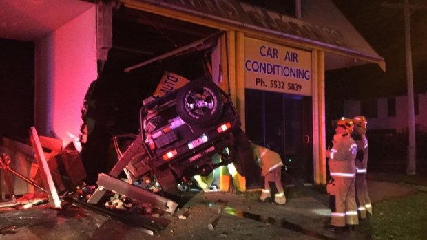 In addition to the five accidents, police are investigating this Gold Coast crash early on Saturday in which a 4WD went through the window of an auto-electrician's shop in Southport. Police are talking with the 4WD's 20-year-old driver. No-one was injured.