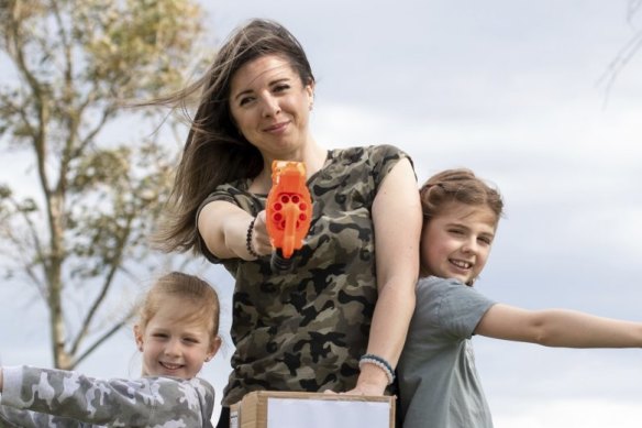 Stavrelle Giourousis and her daughters Georgie ( on the right) 8   years old and Delphi 5 years old with their home made targets and Nerf guns.