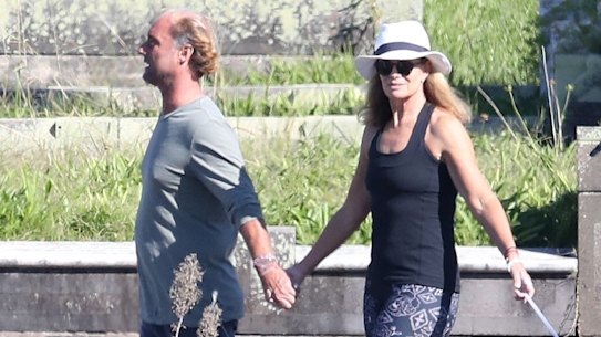 Deborah Hutton and Bondi meditation guru Andrew Marsh out walking in May.
