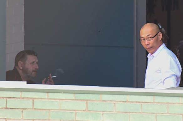 CFMEU NSW secretary Darren Greenfield photographed by police meeting the Chinese gyprocker who bribed him.
