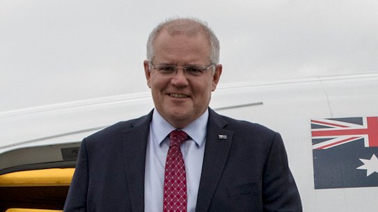Prime Minister Scott Morrison and his wife Jenny arrive at Farnborough airport in London on Tuesday.