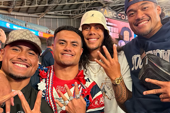 Spencer Leniu celebrates with his former teammates after the grand final.