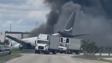 A cargo plane overshot the runway and crashed onto a road at Miami International Airport.