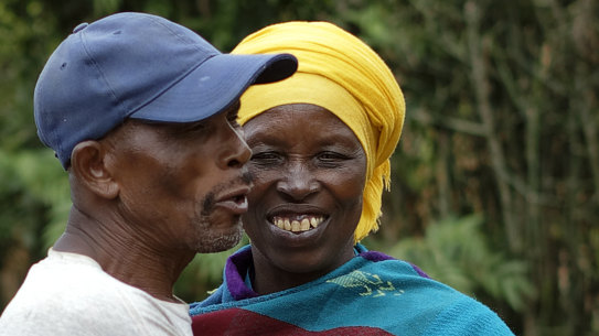 Genocide survivor Laurencia Mukalemera, a Tutsi, greets Tasian Nkundiye, a Hutu who murdered her husband and spent eight years in prison for the killing and other crimes, at Nkundiye's home in the reconciliation village of Mbyo, near Nyamata, in Rwanda. 