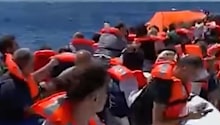 Survivors from the capsized ferry off northern Cyprus wait for rescue.